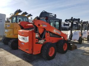 AMECO used construction equipment sits on the ready line after being inspected.