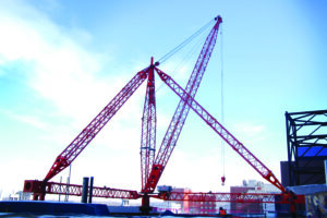 A derrick anchored to the rooftop of a building in Columbus, Ohio